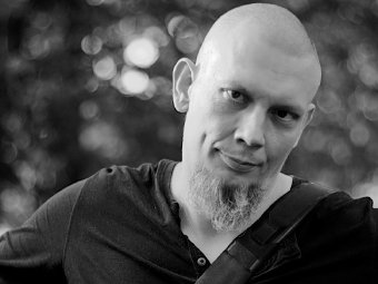 Portrait photo of Paweł Wilk, stylized